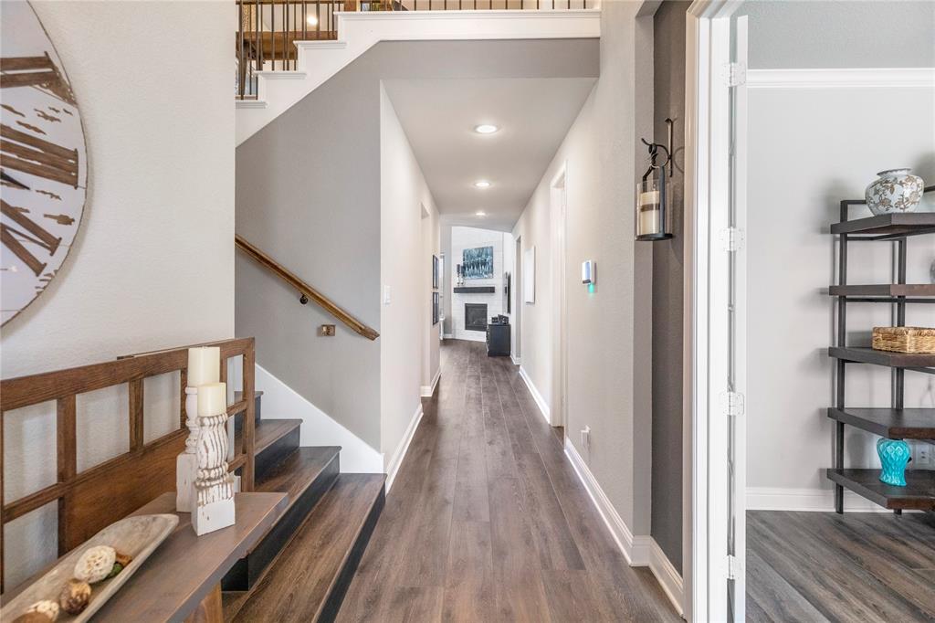 6201 Cupleaf Road Flower Mound, TX 76226 - Photo 13 of 40 a view of a hallway with wooden floor and staircase