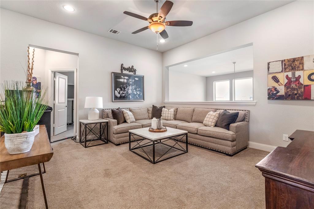 6201 Cupleaf Road Flower Mound, TX 76226 - Photo 15 of 40 a living room with furniture and a potted plant