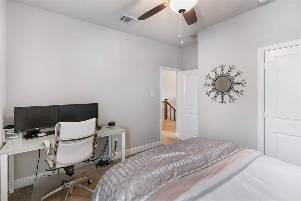 6201 Cupleaf Road Flower Mound, TX 76226 - Photo 20 of 40 a bedroom with a bed and a chandelier