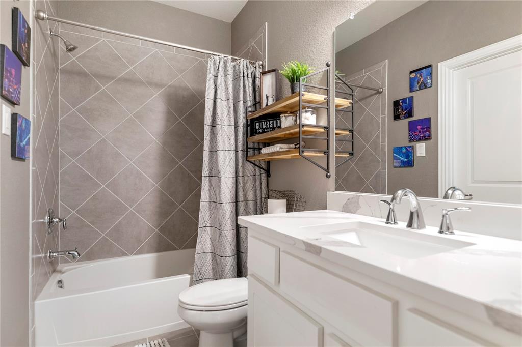 6201 Cupleaf Road Flower Mound, TX 76226 - Photo 21 of 40 a bathroom with a sink toilet and shower