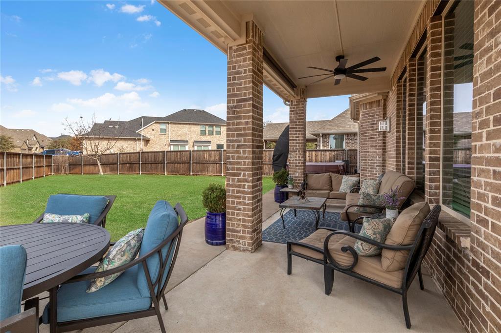 6201 Cupleaf Road Flower Mound, TX 76226 - Photo 27 of 40 a view of a patio with a table chairs and a fire pit