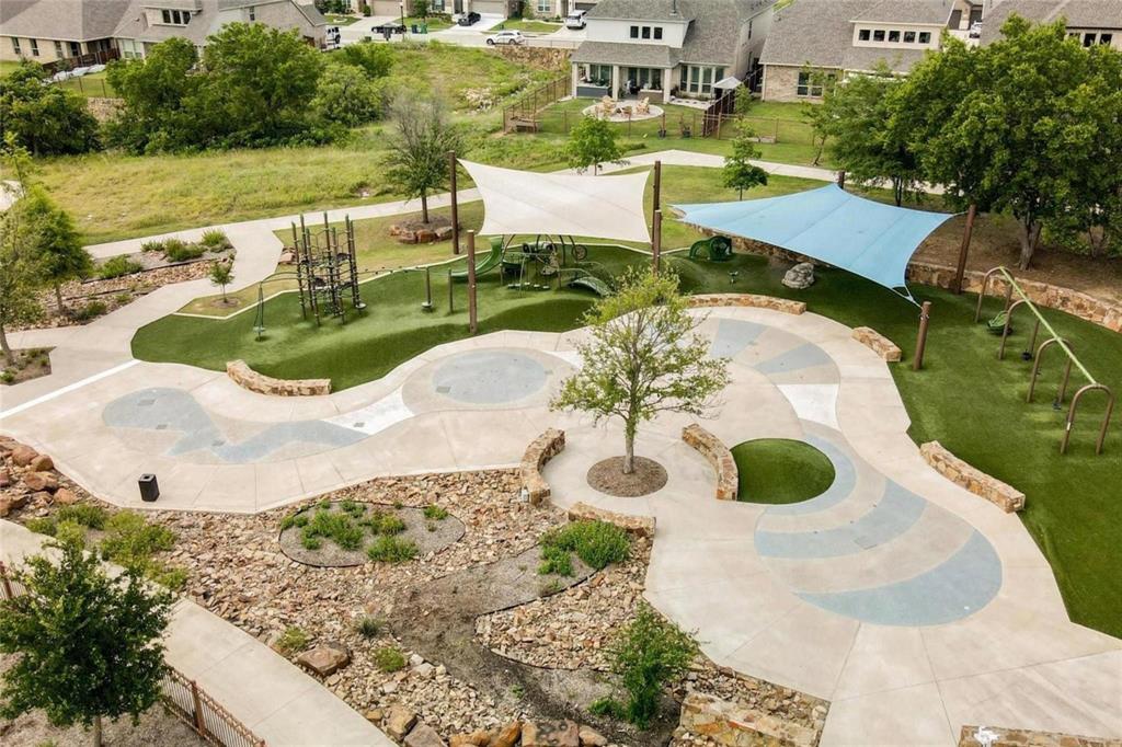 6201 Cupleaf Road Flower Mound, TX 76226 - Photo 34 of 40 a view of a swimming pool with lawn chairs and plants