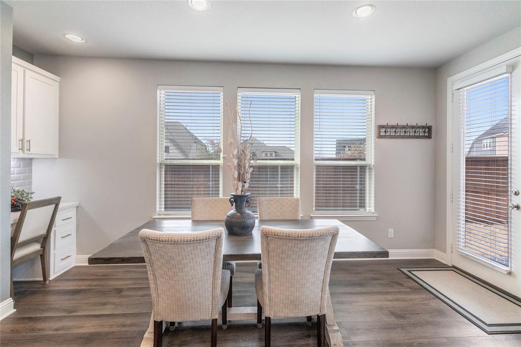 6201 Cupleaf Road Flower Mound, TX 76226 - Photo 7 of 40 a view of a dining room with furniture window and wooden floor