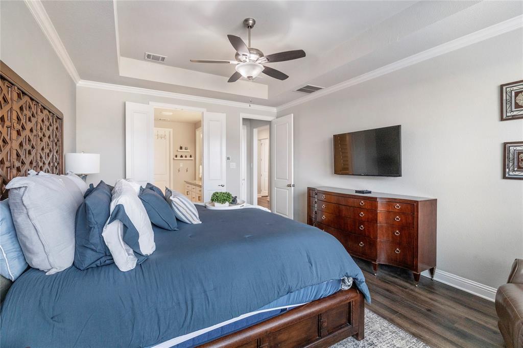 6201 Cupleaf Road Flower Mound, TX 76226 - Photo 10 of 40 a bedroom with a bed and a flat screen tv