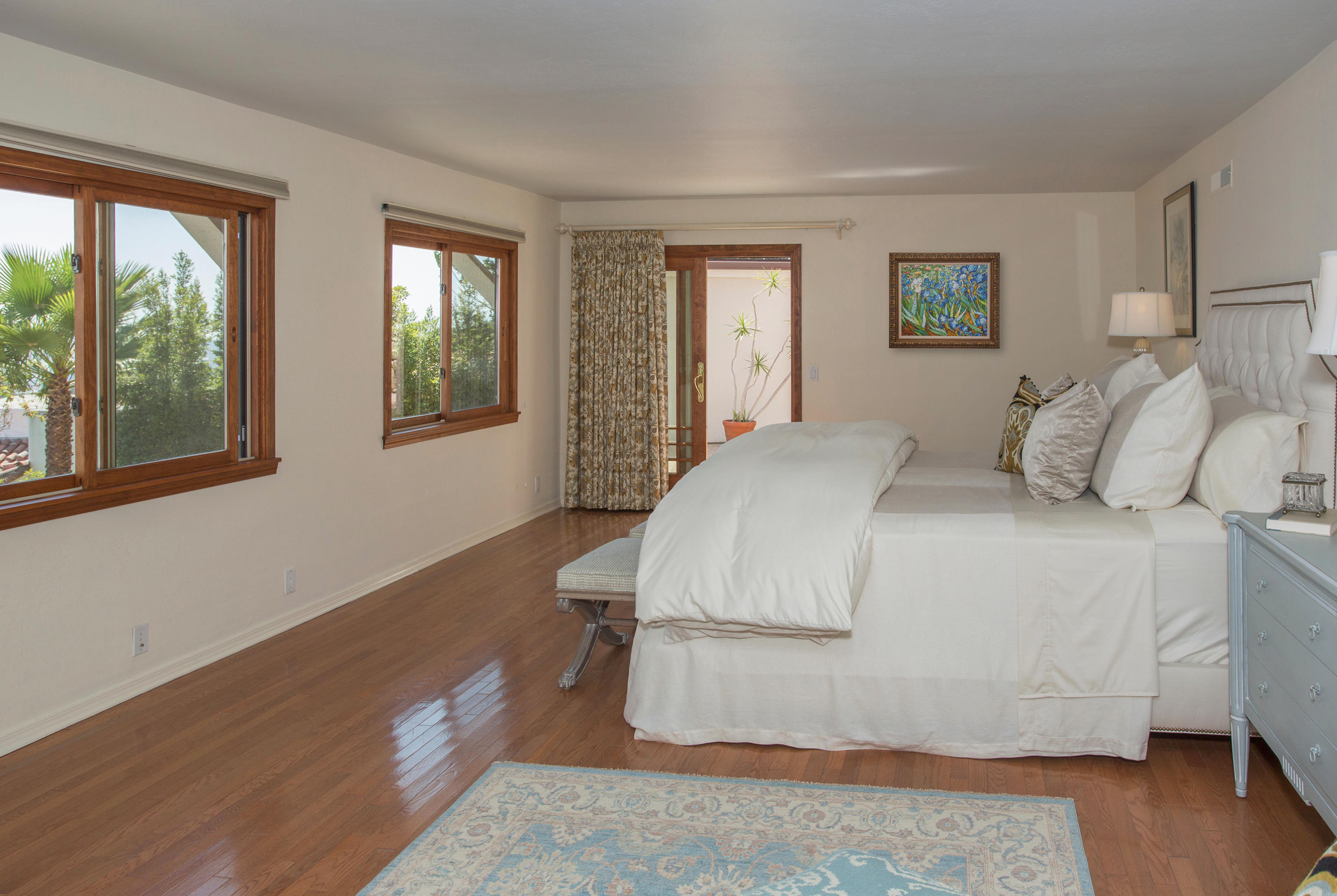 1710 Mission Ridge Road Santa Barbara, CA 93103 - Photo 10 of 19 a bedroom with a bed and wooden floor