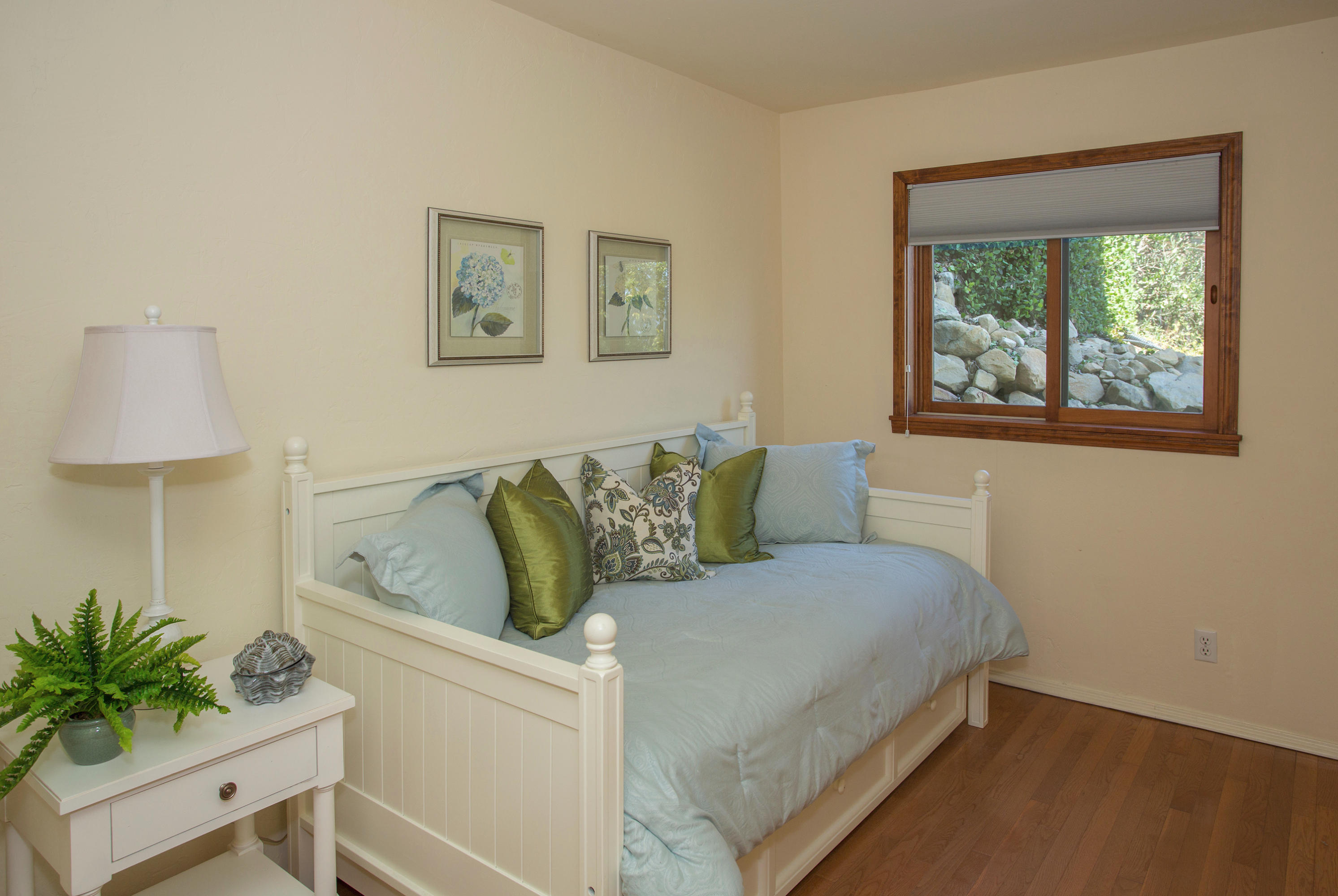 1710 Mission Ridge Road Santa Barbara, CA 93103 - Photo 12 of 19 a living room with a couch and a potted plant