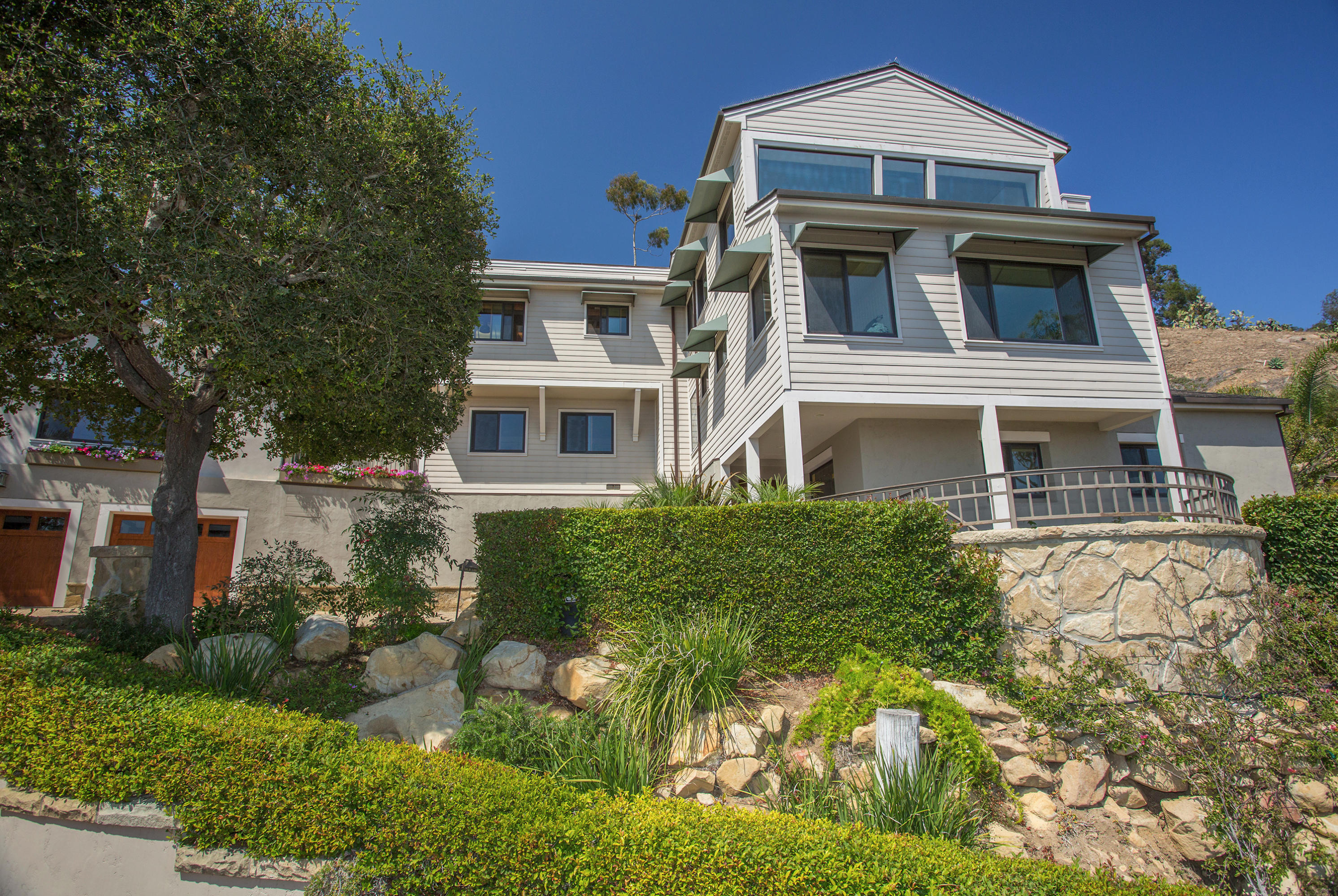 1710 Mission Ridge Road Santa Barbara, CA 93103 - Photo 2 of 19 a front view of a house with a yard