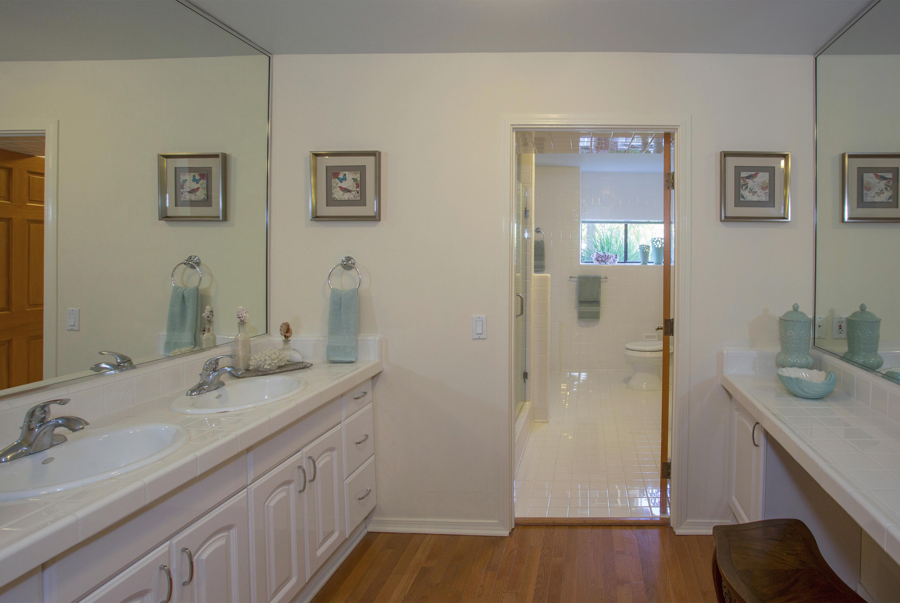 1710 Mission Ridge Road Santa Barbara, CA 93103 - Photo 9 of 19 a bathroom with a granite countertop sink a mirror and shower