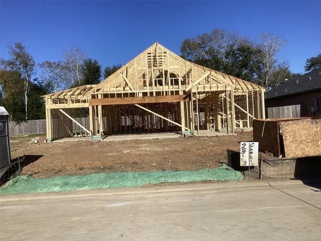 a view of a house next to a yard and road