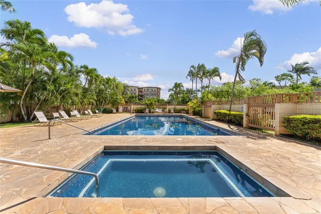 a view of a yard with a house in the background