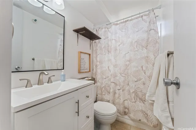 a spacious bedroom with a bed and a window