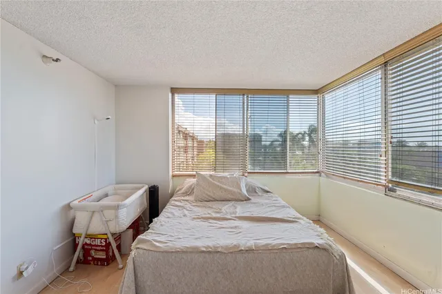 a bedroom with a bed and a view of bathroom