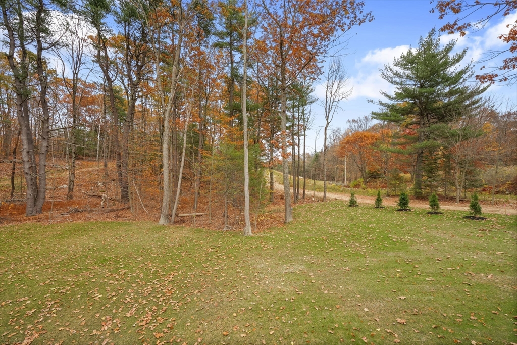 29-4 Sunset Road Westminster, MA 01473 - Photo 31 of 37 a view of a yard with basketball court