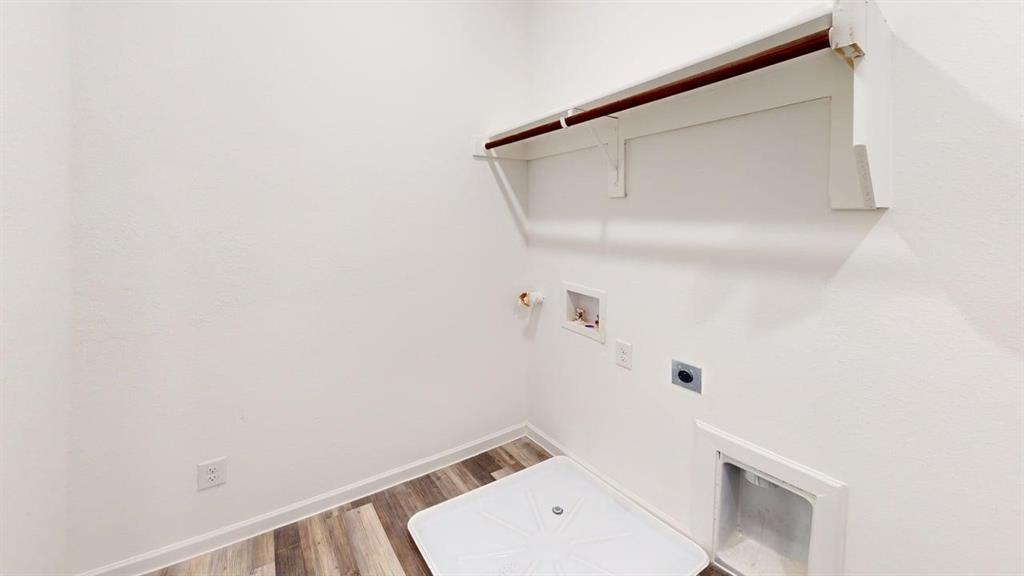 285 Buck Ridge Drive Frisco, TX 75068 - Photo 20 of 20 Laundry room with hookup for an electric dryer, washer hookup, gas dryer hookup, and wood finished floors