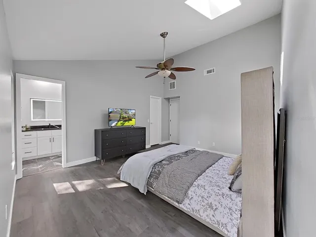 a bedroom with a bed and a view of bathroom