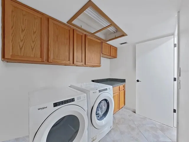 a view of a livingroom with wooden floor and entryway