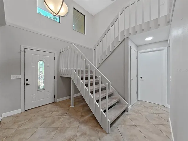 a view of entryway and hall with a front door