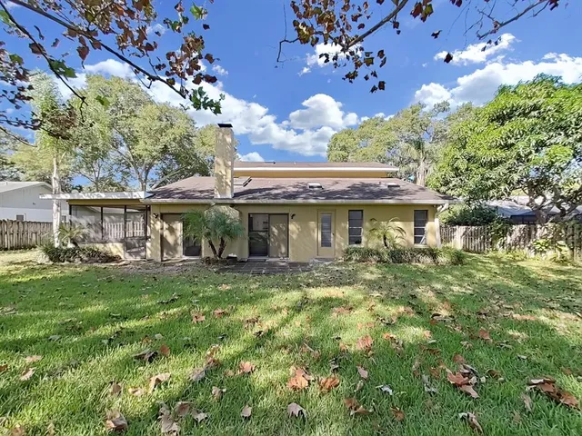 a view of a swimming pool with a lawn chairs