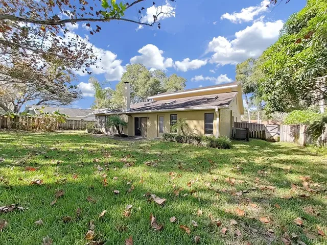 a view of a swimming pool with a yard