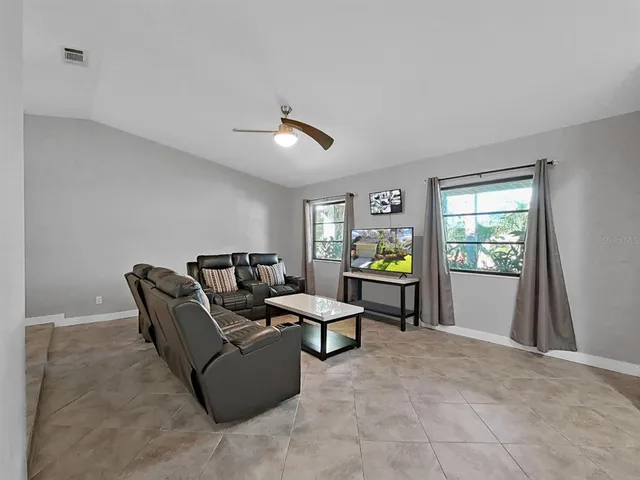 a living room with furniture and a window
