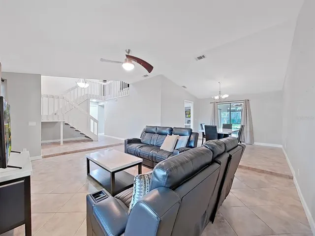 a living room with furniture and a table