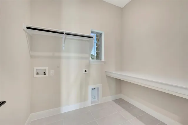 a kitchen with granite countertop white cabinets and stainless steel appliances