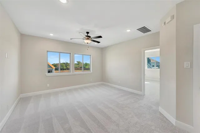 a view of kitchen with refrigerator and window