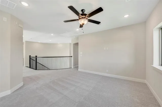 a view of a kitchen with kitchen island a sink stainless steel appliances and cabinets