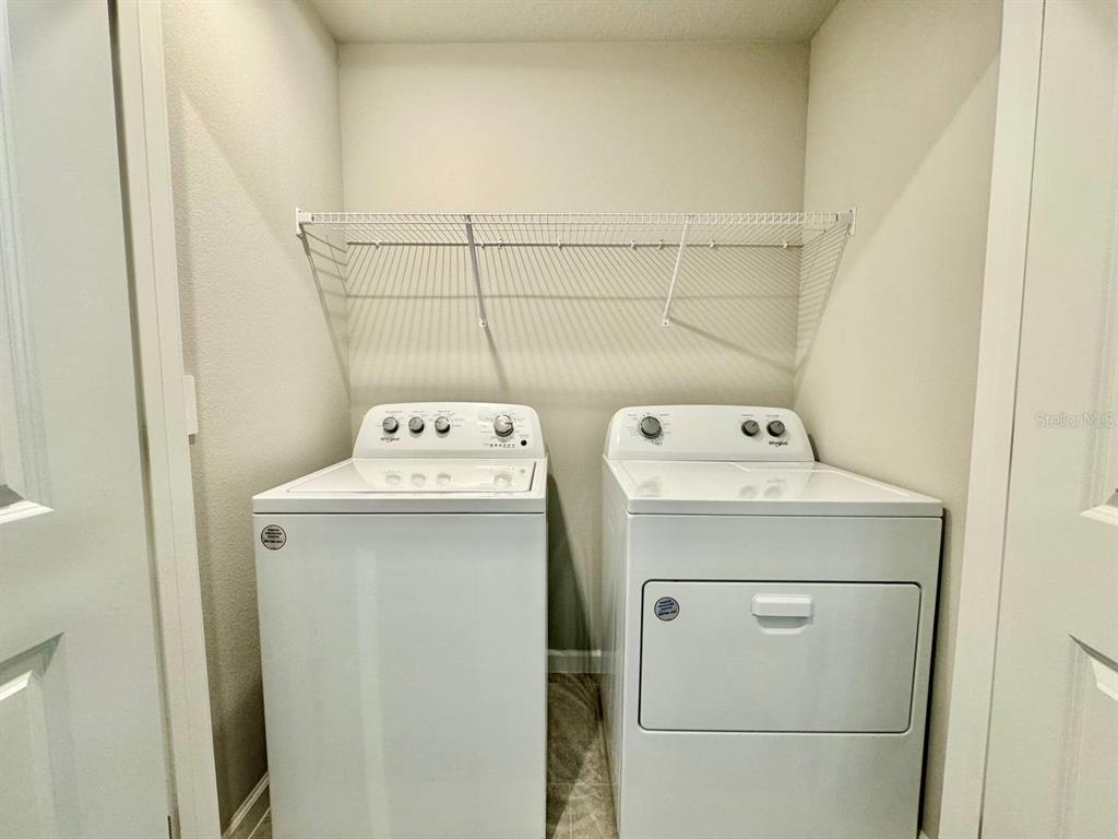 3247 Feather Hvn Place Brandon, FL 33511 - Photo 23 of 34 a utility room with dryer and washer