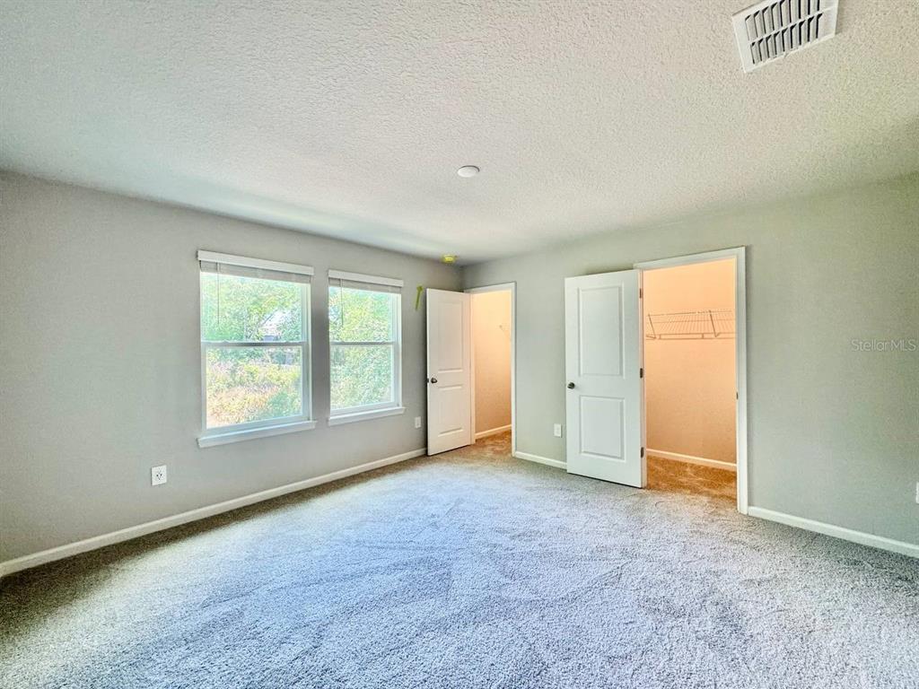 3247 Feather Hvn Place Brandon, FL 33511 - Photo 26 of 34 an empty room with a empty space and windows