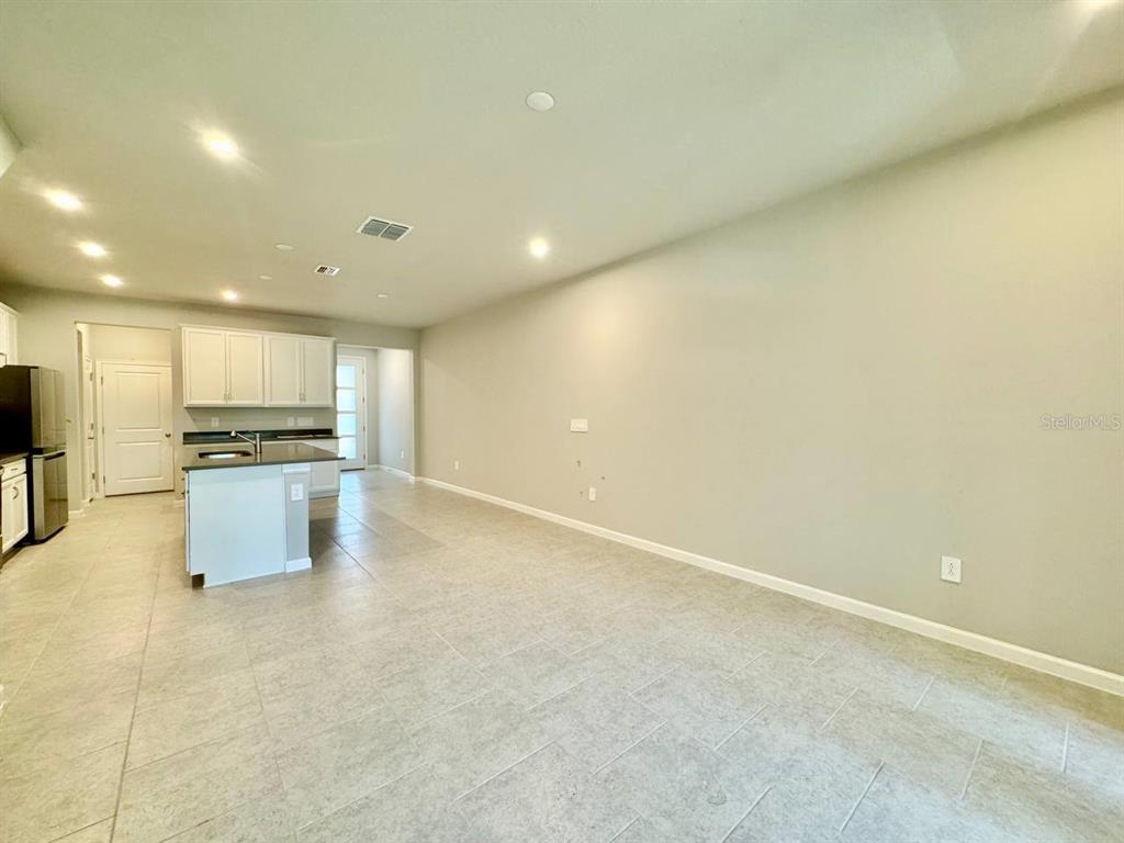 3247 Feather Hvn Place Brandon, FL 33511 - Photo 10 of 34 an empty room with kitchen view and appliances
