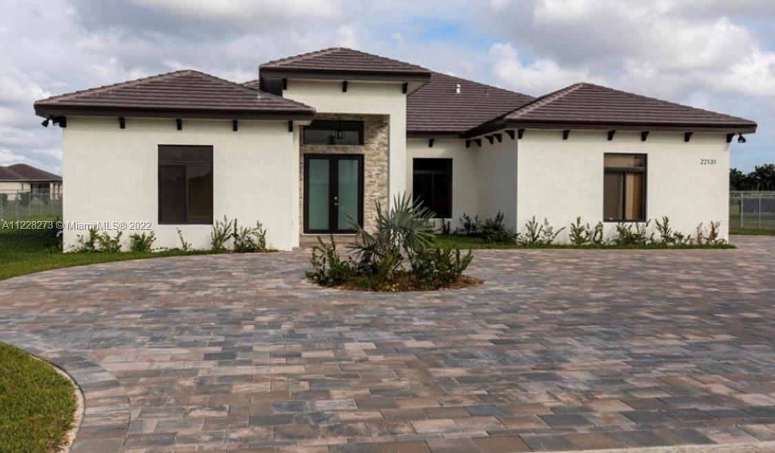 18830 Southwest 354th Street Homestead, FL 33034 - Photo 2 of 14 a front view of a house with a yard