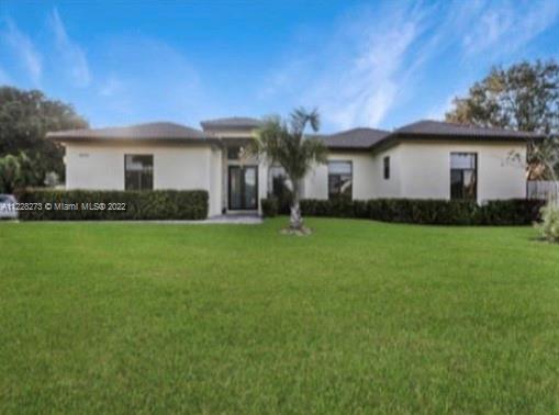18830 Southwest 354th Street Homestead, FL 33034 - Photo 7 of 14 a front view of house with yard and green space