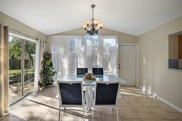 a kitchen with a sink a refrigerator and cabinets