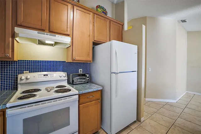 a view of a kitchen with a sink and a window