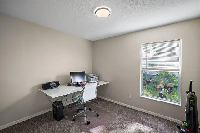 a bathroom with a sink a toilet and shower curtain