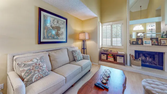 a bedroom with furniture and a large window