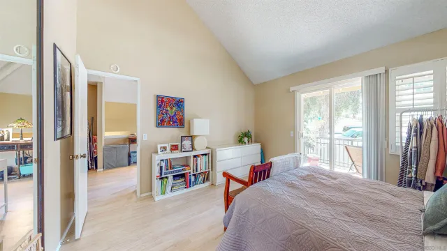 a dining hall with lots of furniture and wooden floor