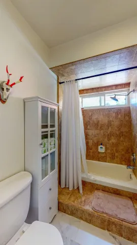 a view of a hallway with workspace and windows