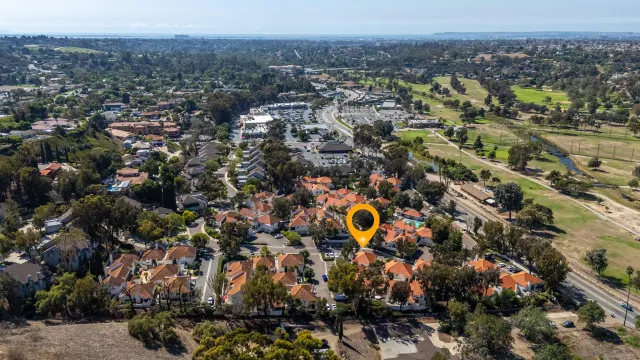 an aerial view of house with swimming pool