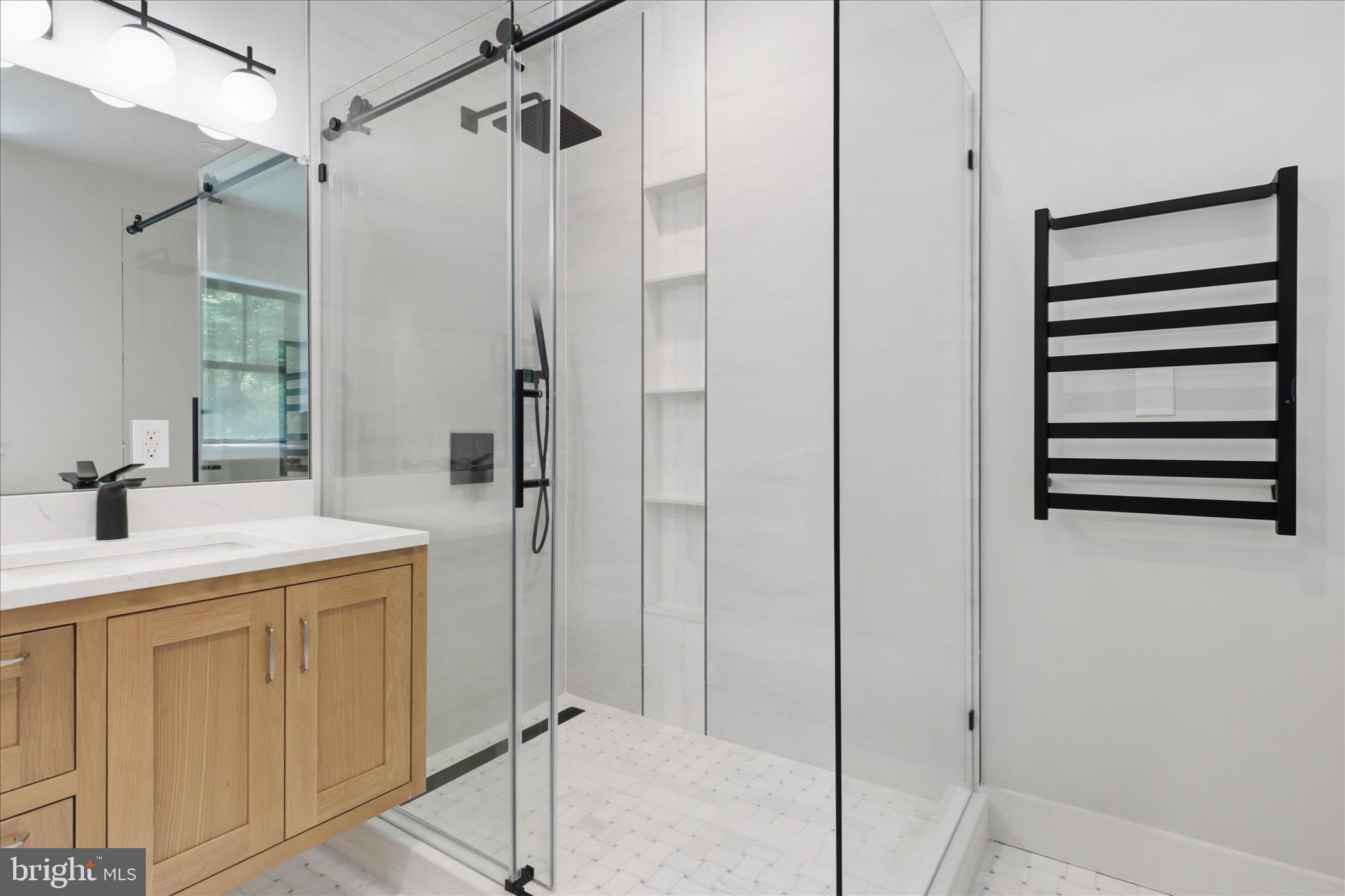 5921 Chesterbrook Road McLean, VA 22101 - Photo 36 of 87 Porcelain tile with marble accent shower walls