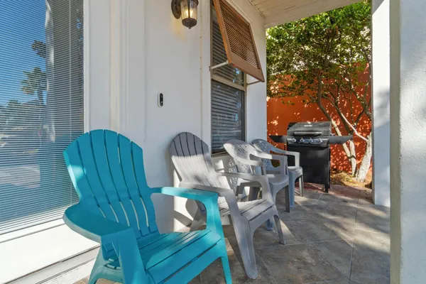 a view of balcony with two chairs and a table