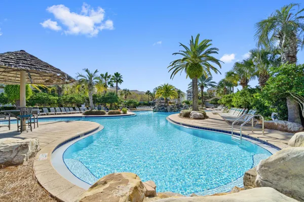 a view of a swimming pool and lounge chair