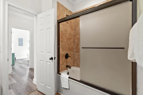 a bathroom with a shower and a sink