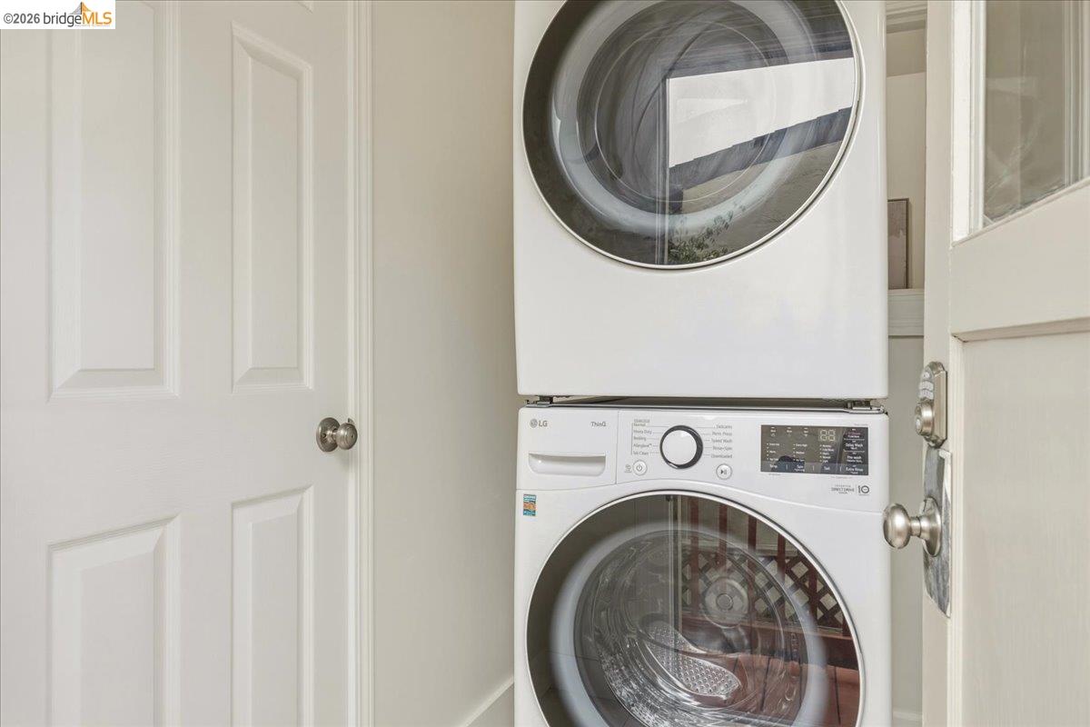 2403 Cedar Street Berkeley, CA 94708 - Photo 13 of 33 White stacked washer and dryer unit with digital displays and front-loading doors
