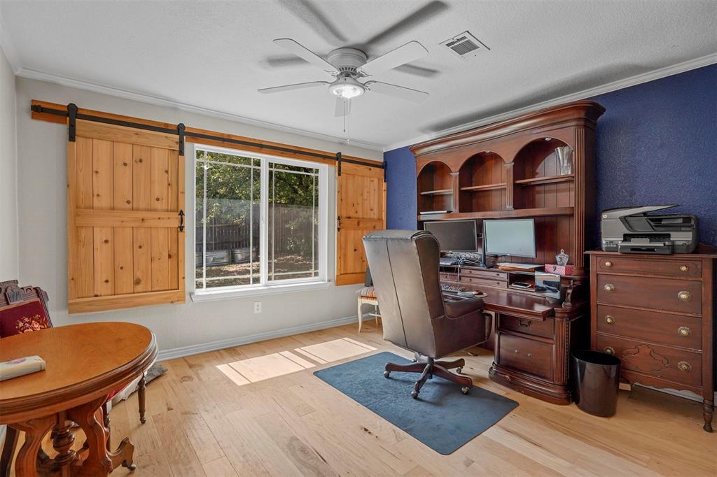 7130 Briar Road Azle, TX 76020 - Photo 17 of 37 a view of a workspace with furniture and a window