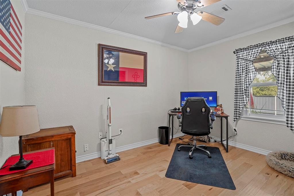 7130 Briar Road Azle, TX 76020 - Photo 19 of 37 a view of a workspace with furniture and a window