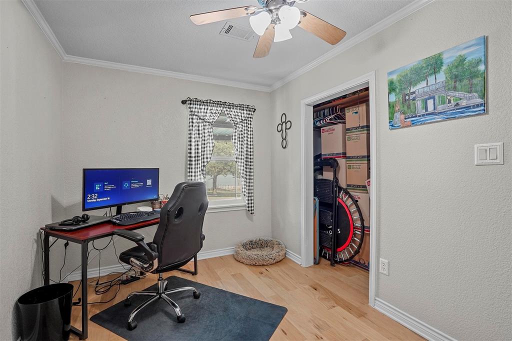 7130 Briar Road Azle, TX 76020 - Photo 20 of 37 a view of a workspace with furniture and a window