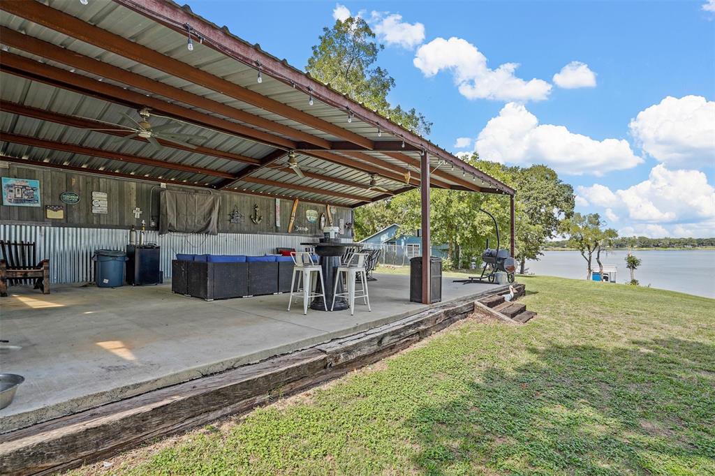 7130 Briar Road Azle, TX 76020 - Photo 26 of 37 a view of a backyard with table and chairs