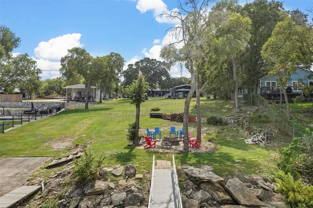 a view of a park with iron fence
